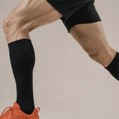 Close-up of toned leg muscles during a lower body strength training and fitness workout.